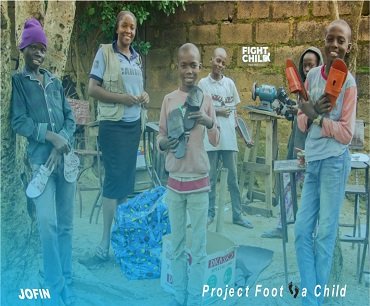 JOFIN volunteers with children at a community outreach